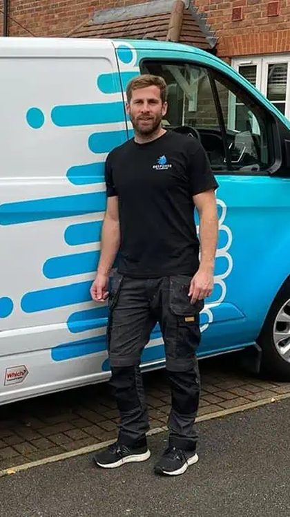 Response Plumbing emergency plumber Surrey holding a Keep Me Card — advertiser testimonial