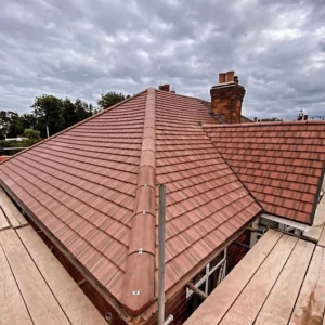 Full re-roof with terracotta tiles in Woking by Franks Roofing Service